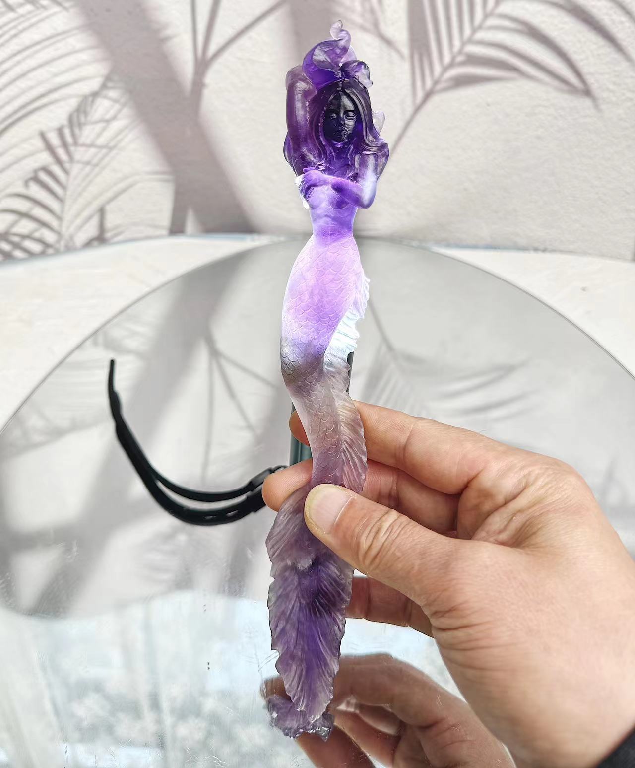 Mermaid carving from purple crystal