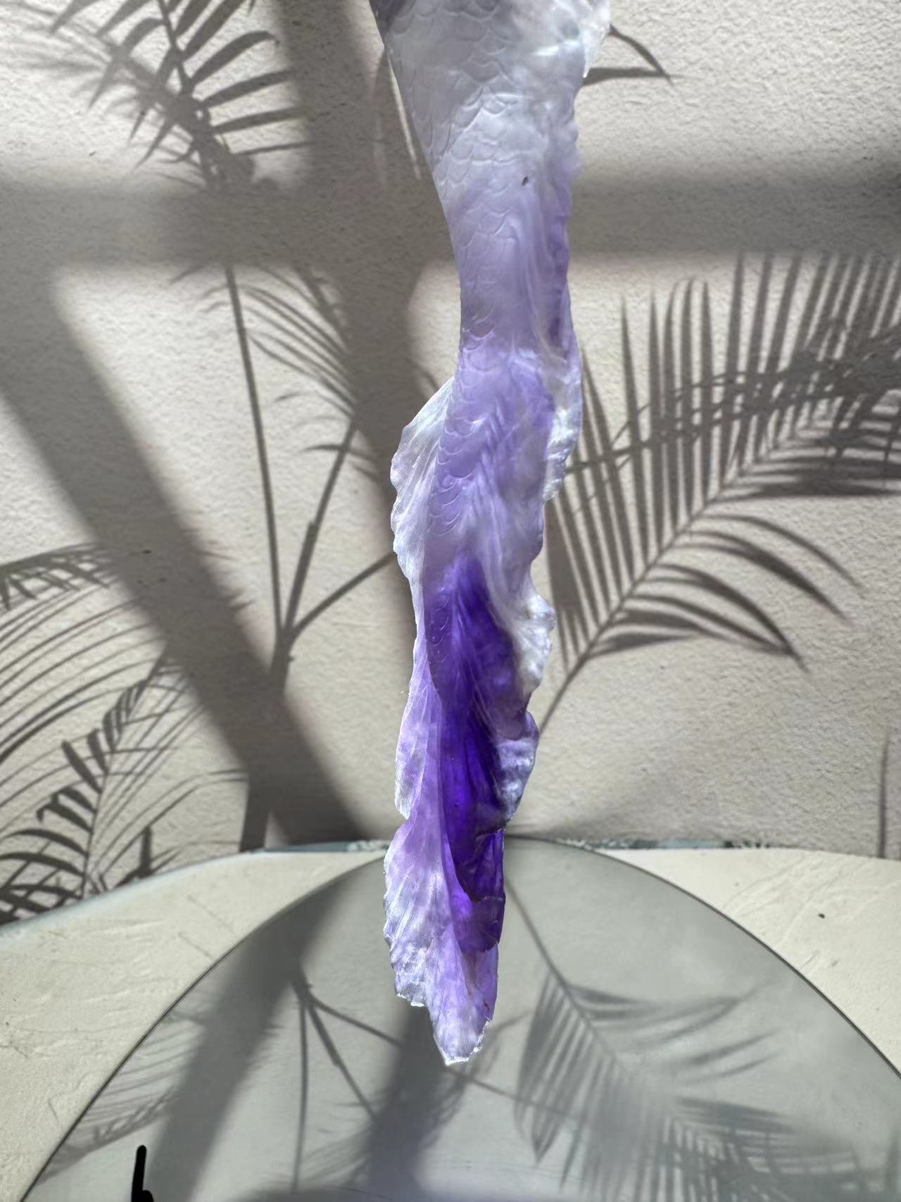 Mermaid carving from purple crystal