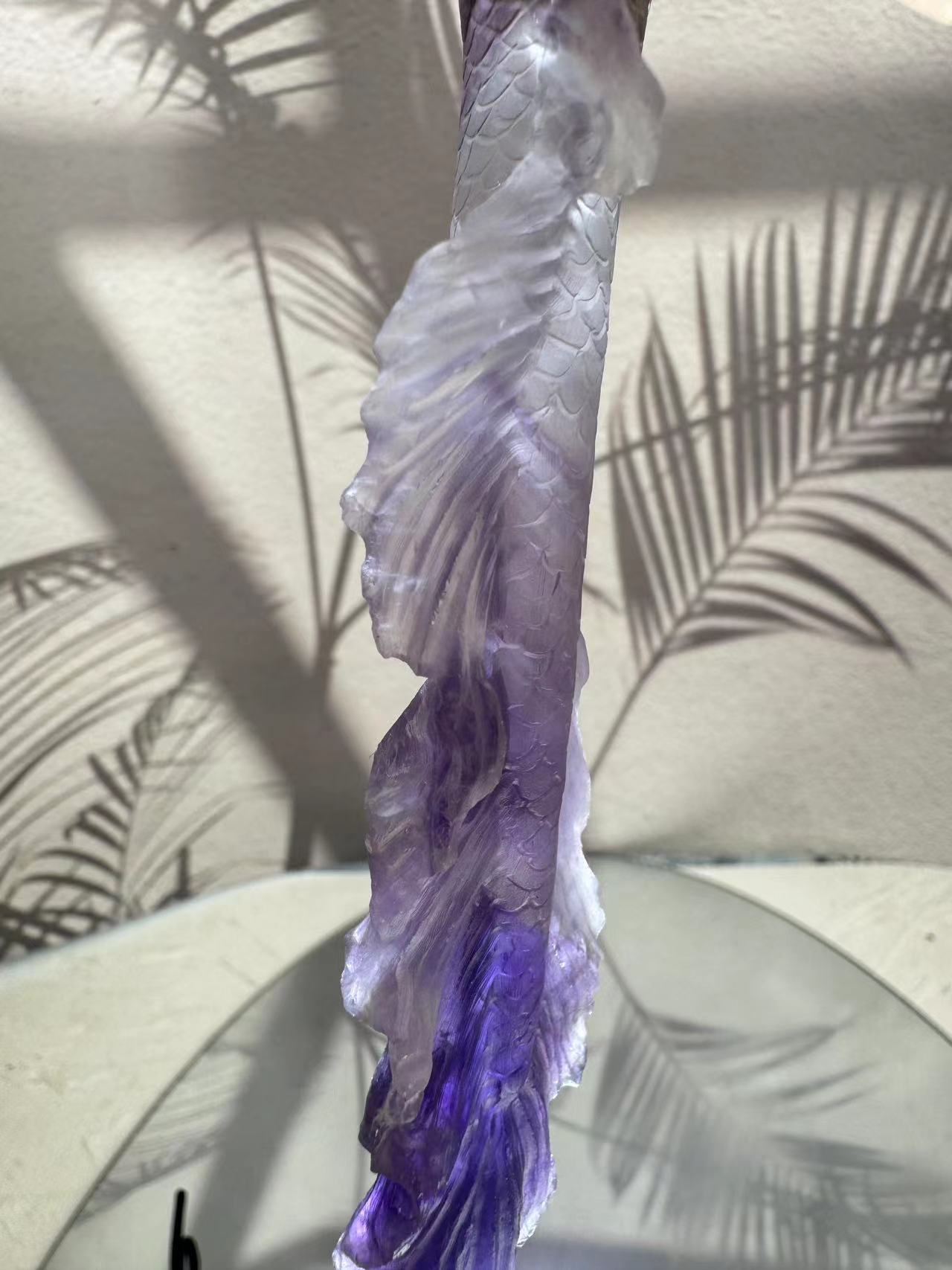 Mermaid carving from purple crystal