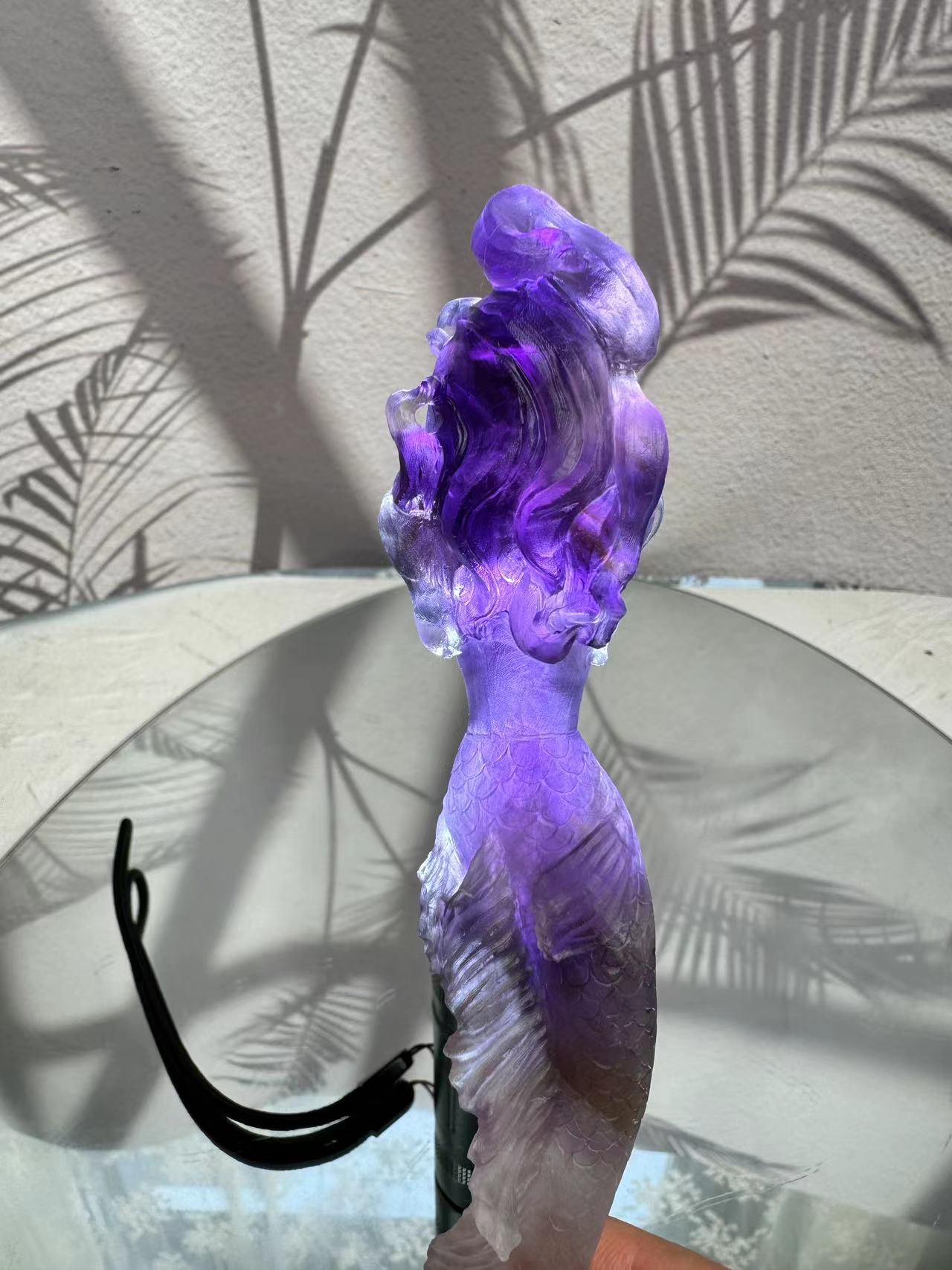 Mermaid carving from purple crystal