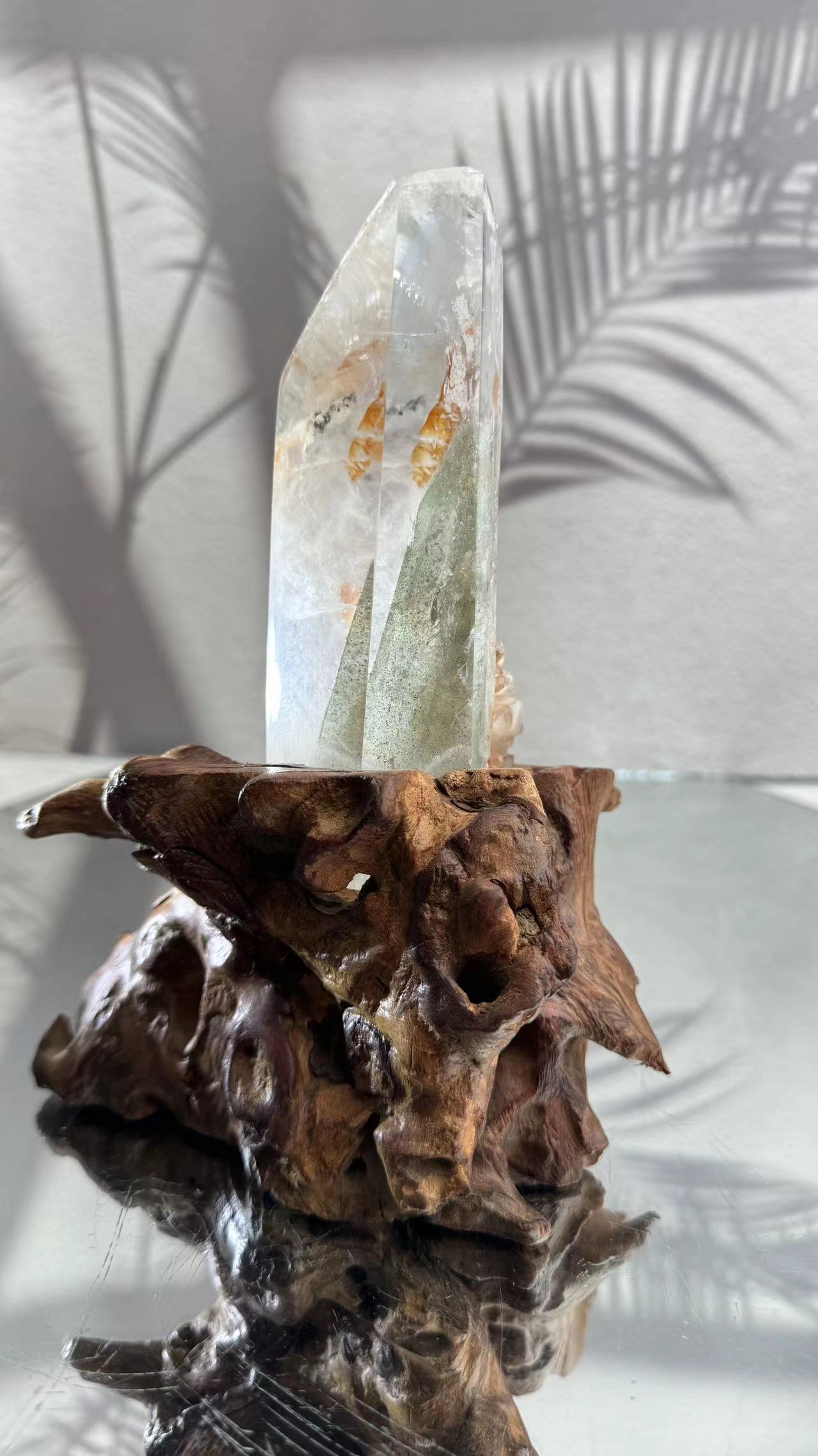 A chlorite crystal tower grows inside the white crystal.