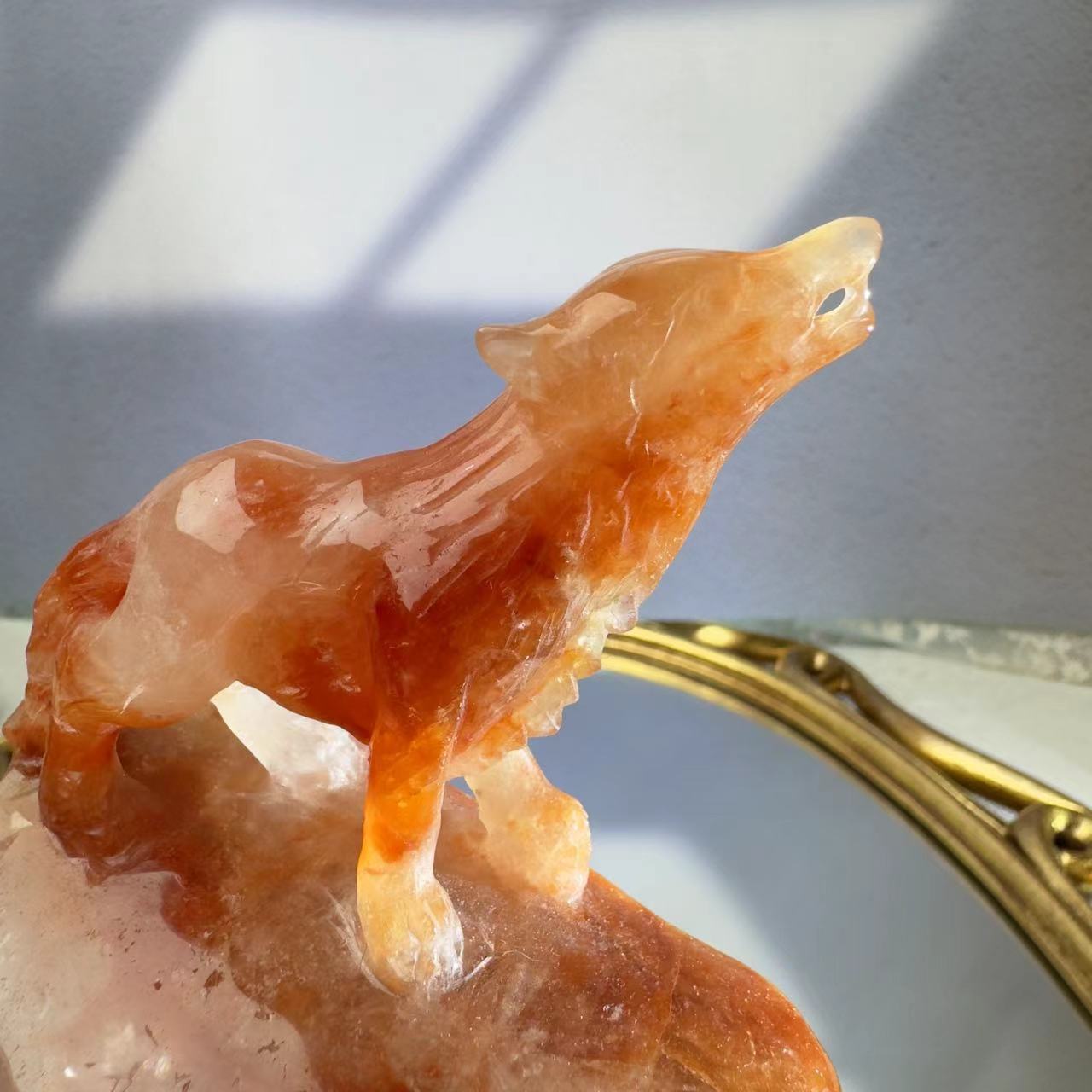 Wolf carved from red crystal.