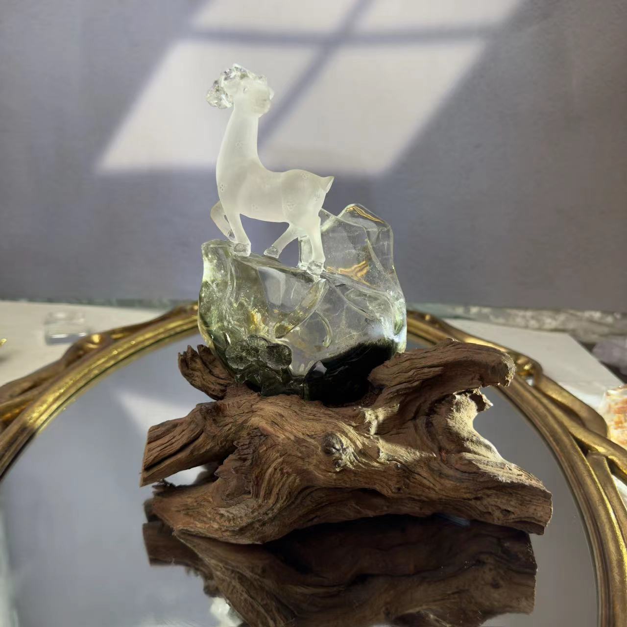 A deer carved from chlorite crystal. A chlorite crystal from Brazil was hand-carved and polished to look like a deer.