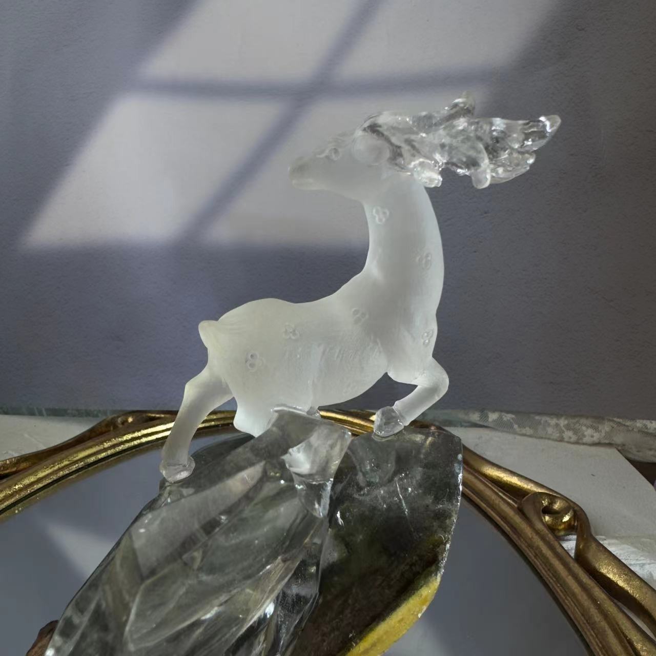 A deer carved from chlorite crystal. A chlorite crystal from Brazil was hand-carved and polished to look like a deer.