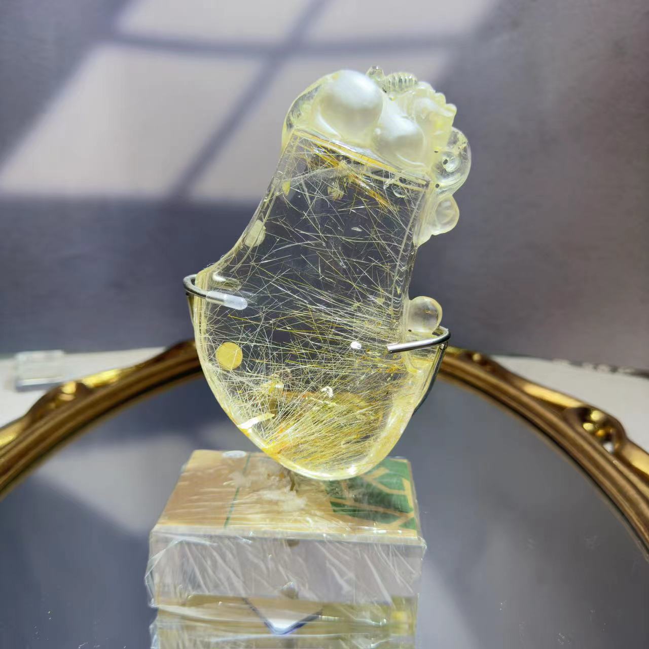 A mythical beast from Chinese legend carved from rutile crystal.