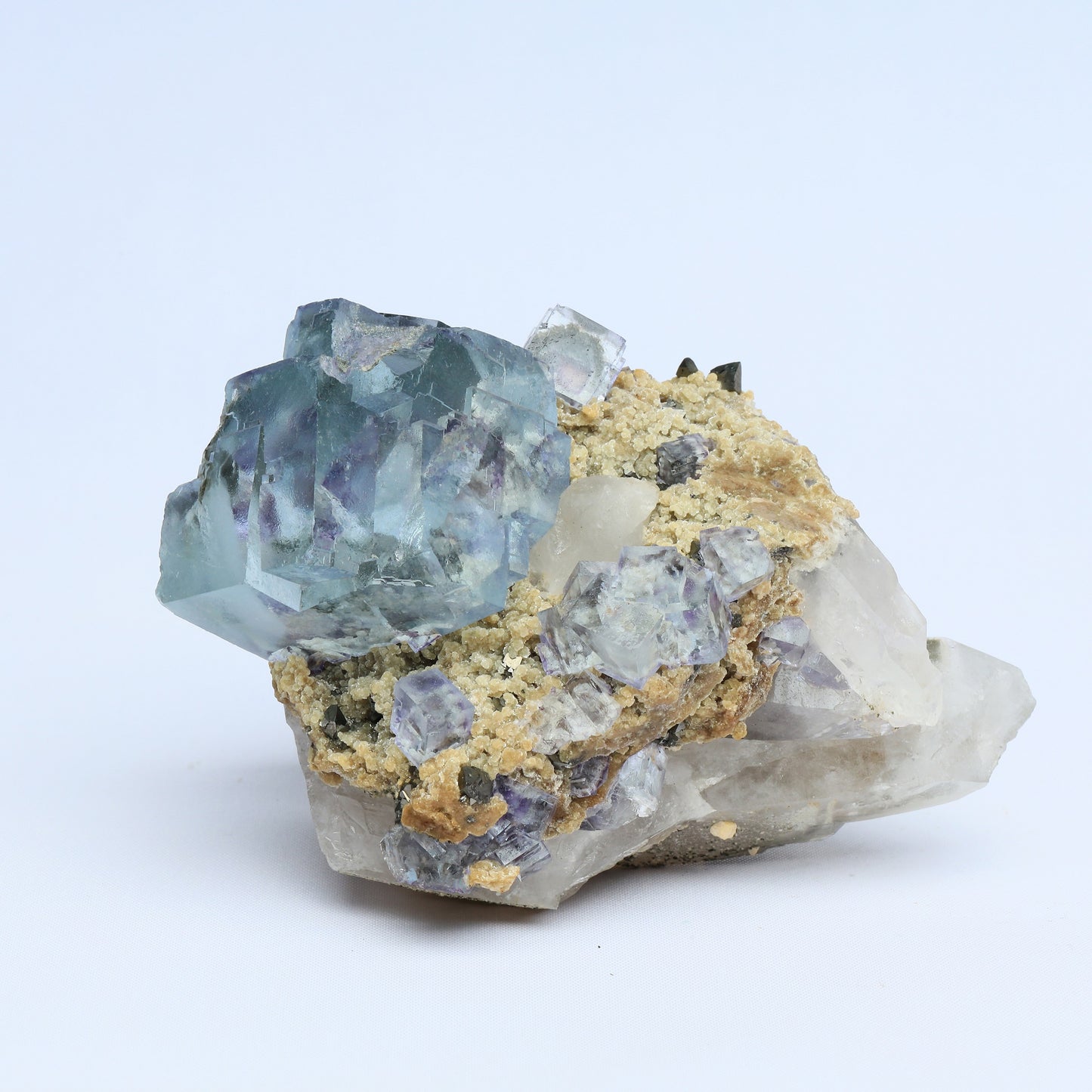 Symbiosis of fluorite crystal, calcite and black tungsten.