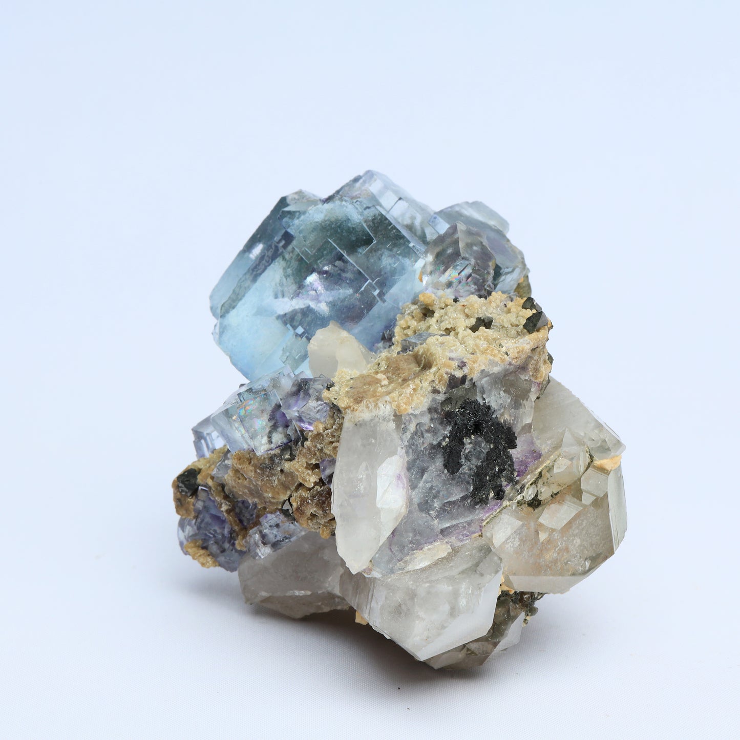 Symbiosis of fluorite crystal, calcite and black tungsten.