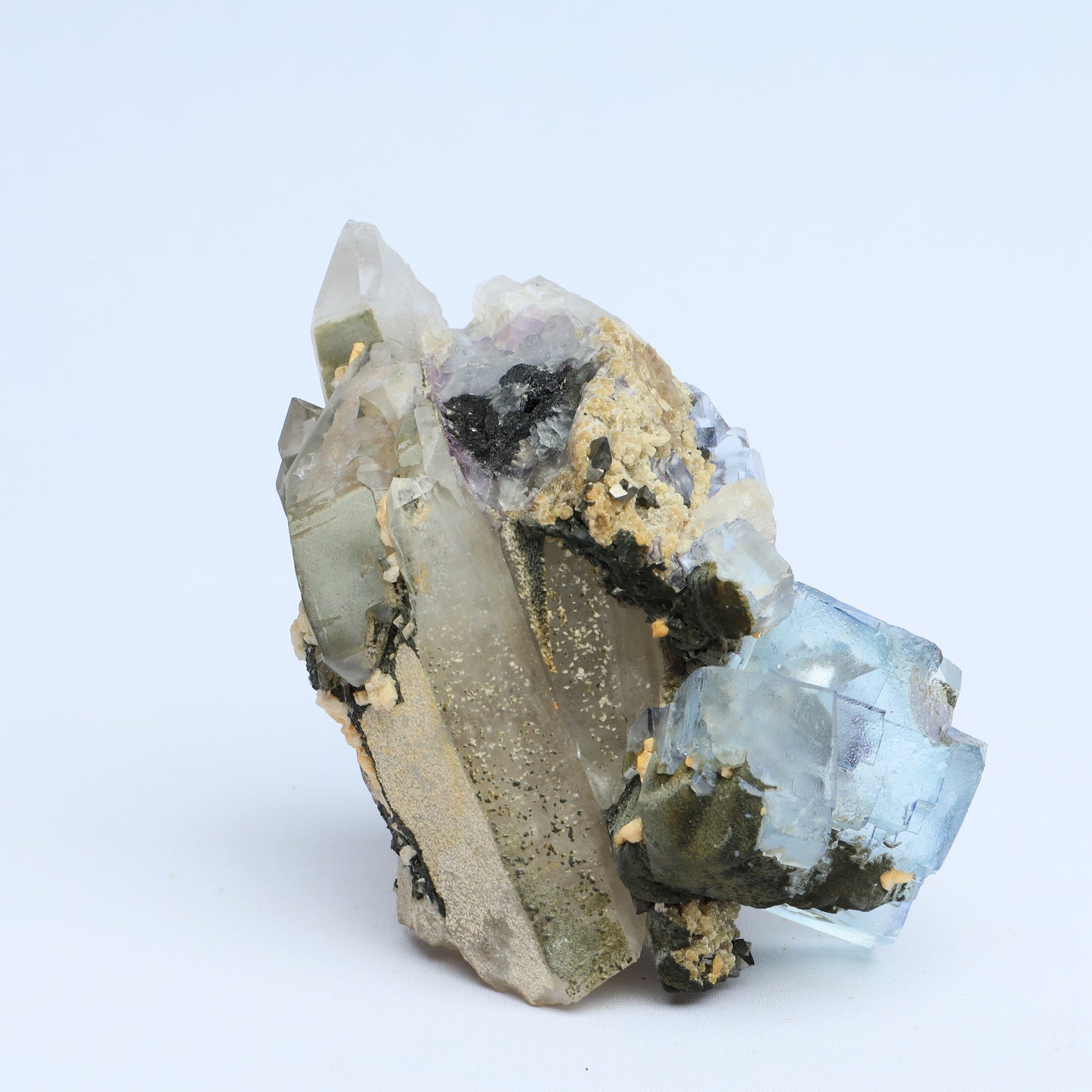 Symbiosis of fluorite crystal, calcite and black tungsten.