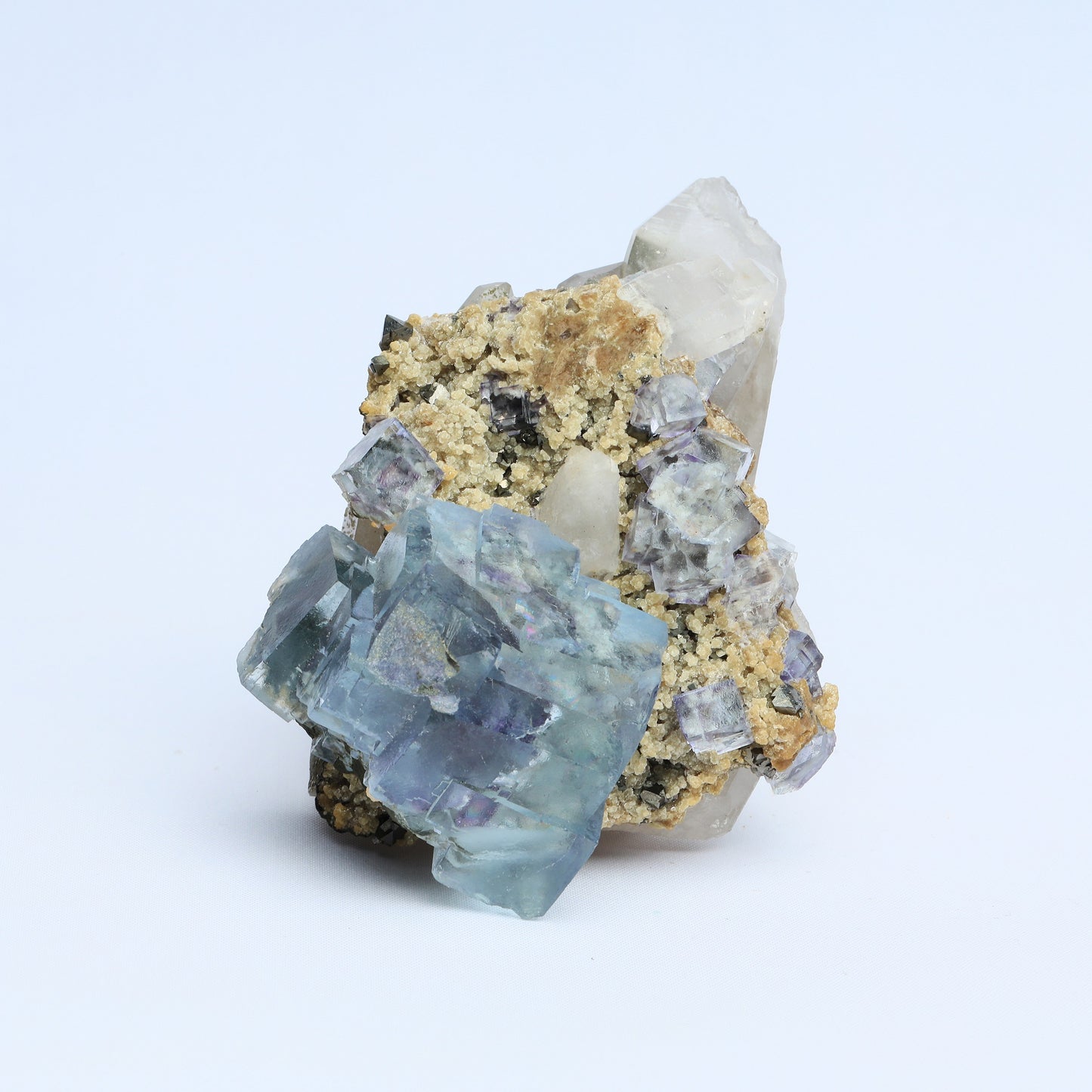 Symbiosis of fluorite crystal, calcite and black tungsten.