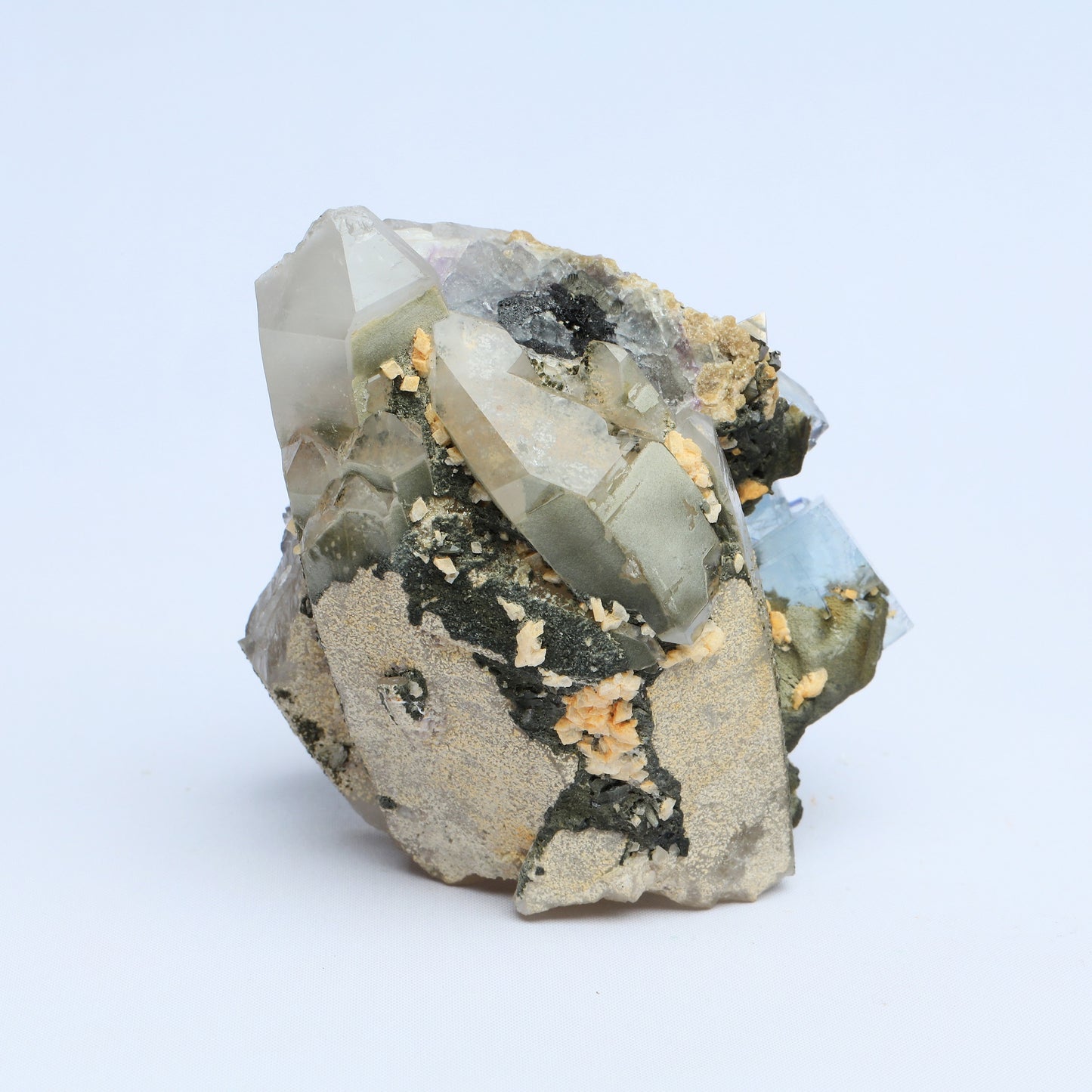 Symbiosis of fluorite crystal, calcite and black tungsten.