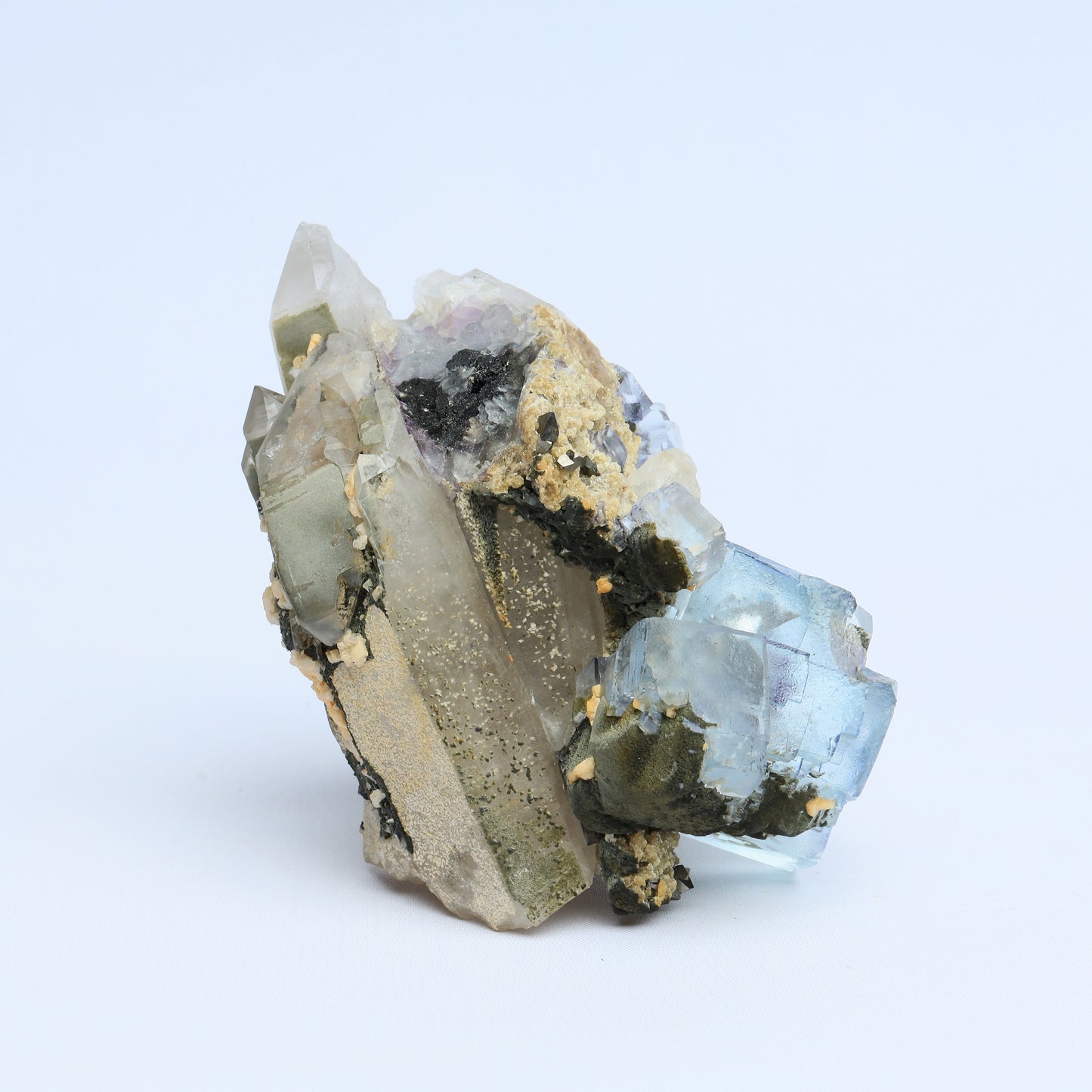 Symbiosis of fluorite crystal, calcite and black tungsten.